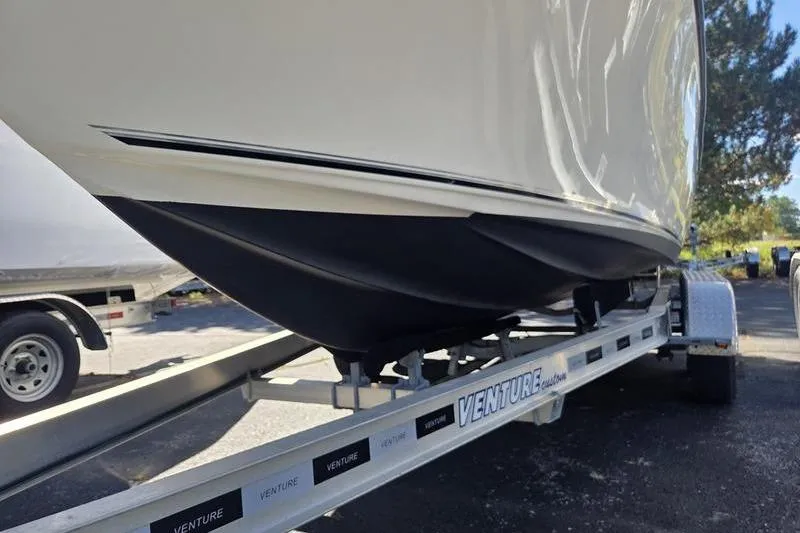 Slide: The Image of 2023 Key West 203 FS boat on Venture trailer, parked outdoors. - 12