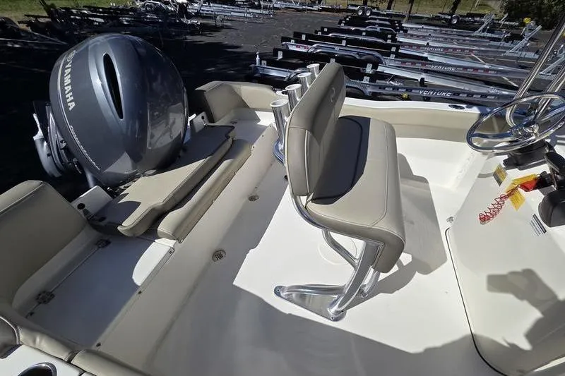 Slide: The Image of 2023 Key West 203 FS boat interior with Yamaha engine and seating area. - 6