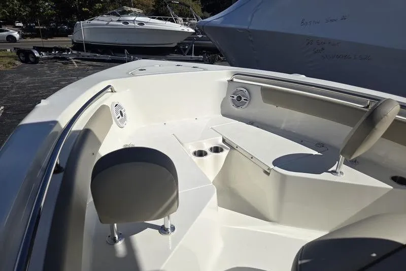 Slide: The Image of 2023 Key West 203 FS boat interior with seating and cup holders. - 8