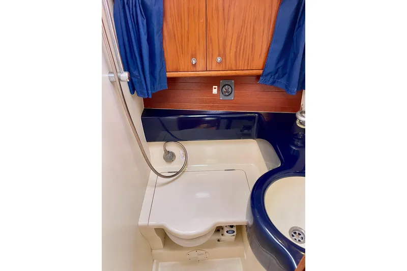 Slide: The Image of Compact bathroom in 2000 Moody 42 CC yacht with shower and sink. - 18