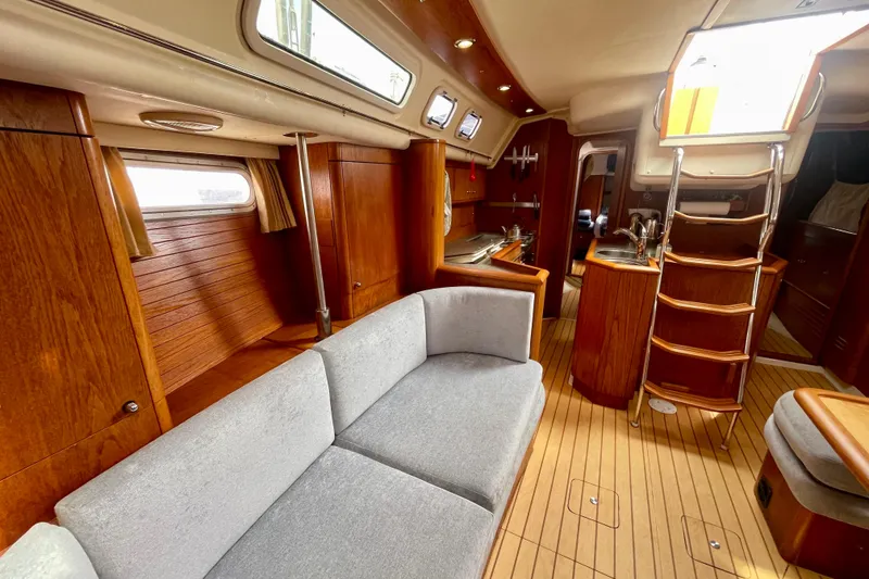 Slide: The Image of Luxurious interior of 2000 Moody 42 CC yacht with wooden finishes and modern amenities. - 25