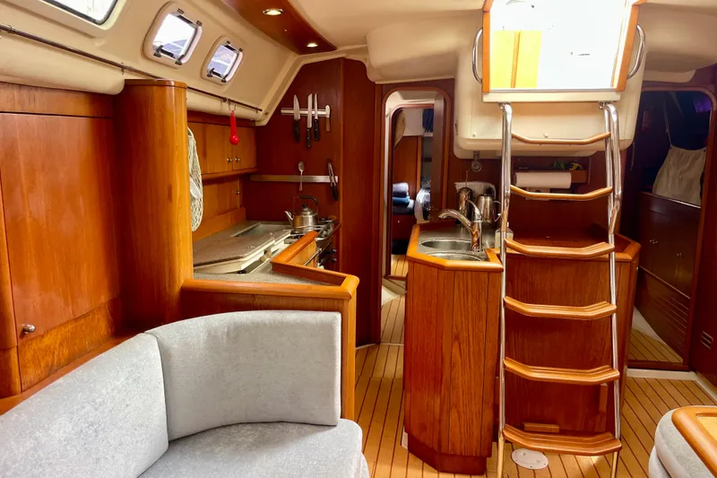 Slide: The Image of Interior of 2000 Moody 42 CC yacht with wooden finish and modern amenities. - 26
