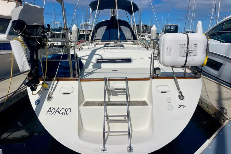 Slide: The Image of Moody 42 CC sailboat, 2000 model, docked with ladder and equipment visible. - 3