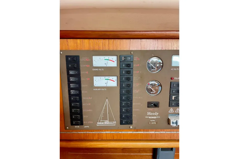 Slide: The Image of Electrical control panel of a 2000 Moody 42 CC yacht with voltmeters and switches. - 39