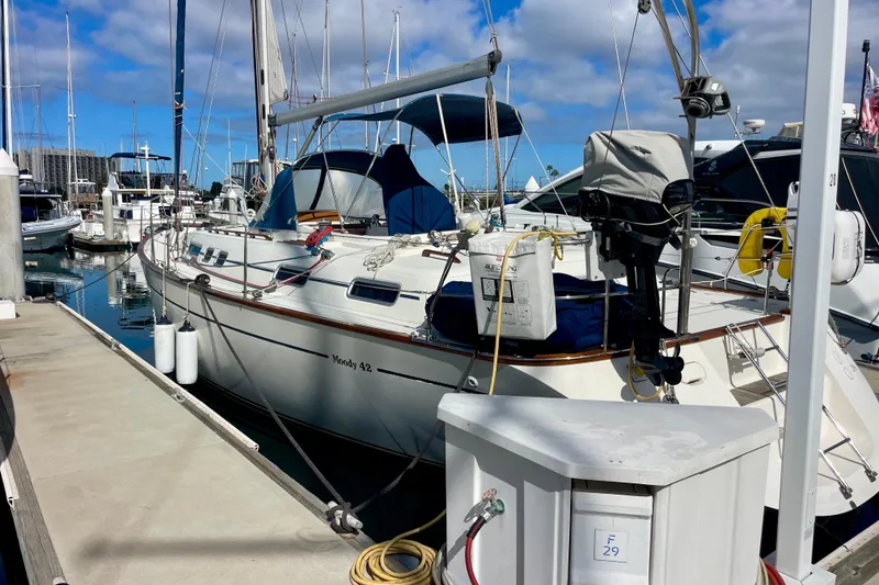 Slide: The Image of Sailboat Moody 42 CC, 2000 model, docked at marina under blue sky. - 4