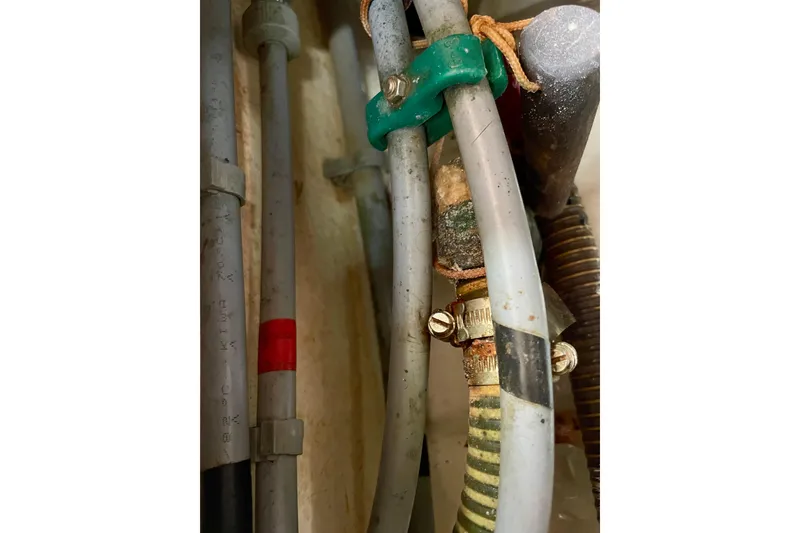 Slide: The Image of Close-up of plumbing pipes and fittings on a 2000 Moody 42 CC yacht. - 53