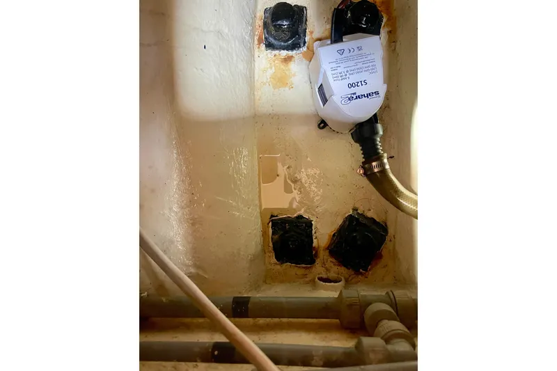 Slide: The Image of Bilge area of 2000 Moody 42 CC sailboat with pump and hoses. - 55