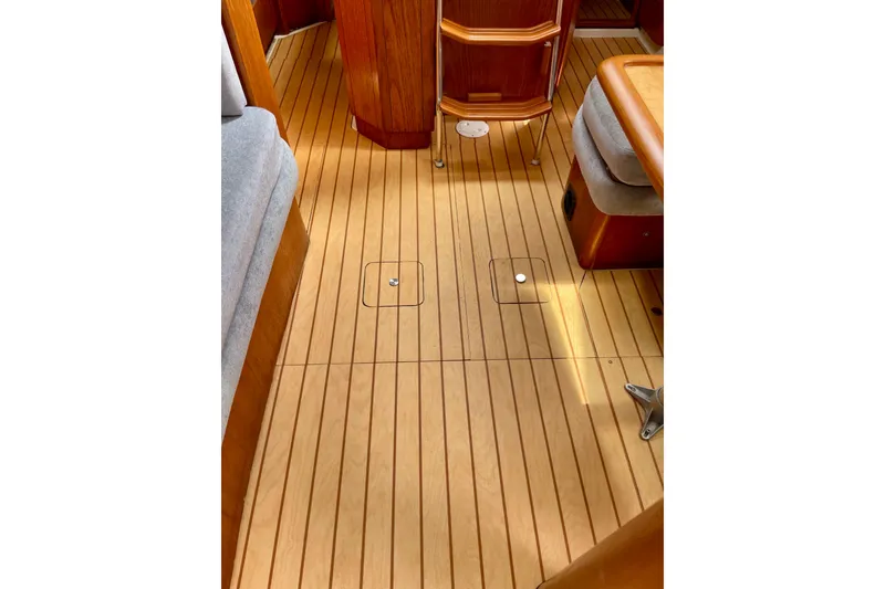 Slide: The Image of Interior of 2000 Moody 42 CC yacht with wooden flooring and seating. - 56