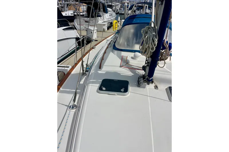 Slide: The Image of Sailboat deck view of 2000 Moody 42 CC, docked in a marina. - 64
