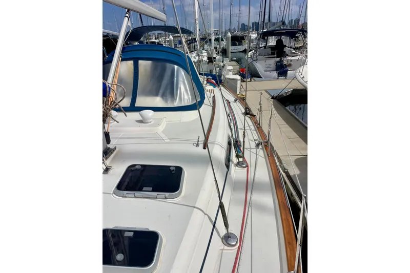 Slide: The Image of Sailboat Moody 42 CC, 2000 model, docked in a marina with clear blue skies. - 65