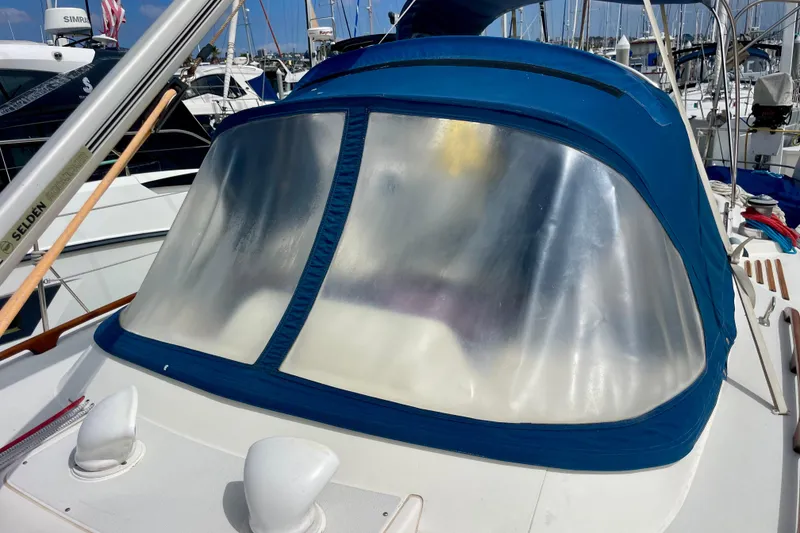 Slide: The Image of Moody 42 CC sailboat cockpit with blue canvas cover, 2000 model, docked at marina. - 66