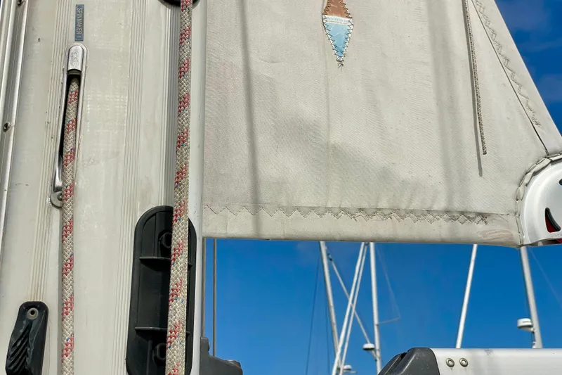 Slide: The Image of Close-up of a Moody 42 CC sailboat mast and sail, showcasing rigging details. - 69