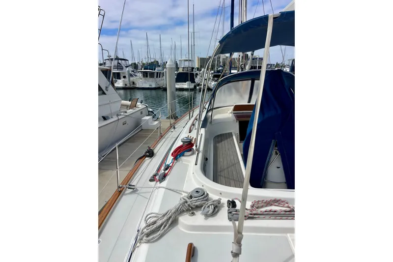 Slide: The Image of Sailboat Moody 42 CC 2000 model docked at marina with ropes and canopy. - 70