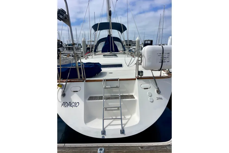 Slide: The Image of Sailboat Moody 42 CC, 2000 model, docked with visible ladder and equipment. - 73