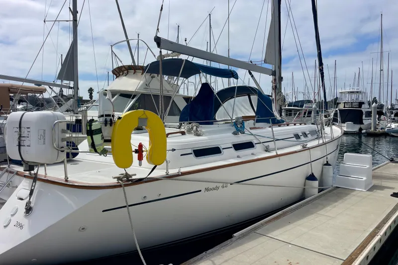 Slide: The Image of Sailboat Moody 42 CC, 2000 model, docked at marina with clear sky background. - 74