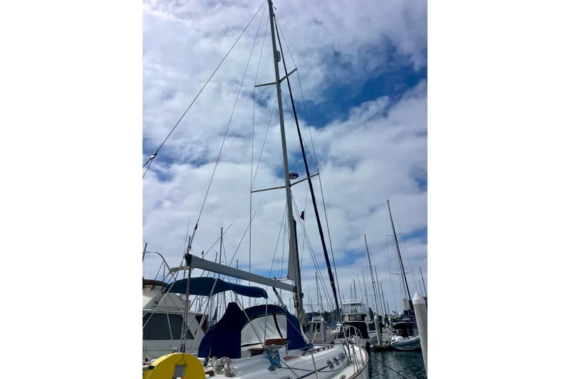 Slide: The Image of Sailboat Moody 42 CC, 2000 model, docked under a cloudy sky. - 75