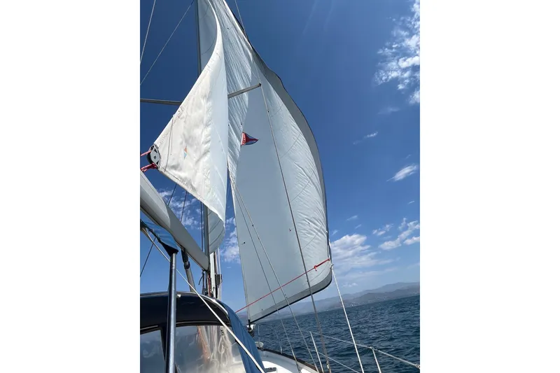 Slide: The Image of Sailing on a 2000 Moody 42 CC yacht under clear blue skies. - 82