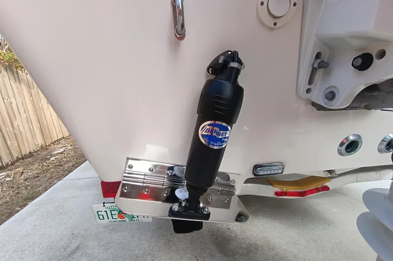 Slide: The Image of 2024 Sea Chaser 24 HFC boat with Bennett trim tab system, rear view. - 14