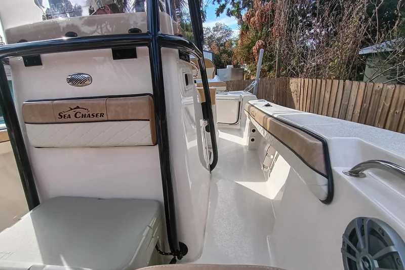 Slide: The Image of 2024 Sea Chaser 24 HFC boat interior with seating and storage compartments. - 29