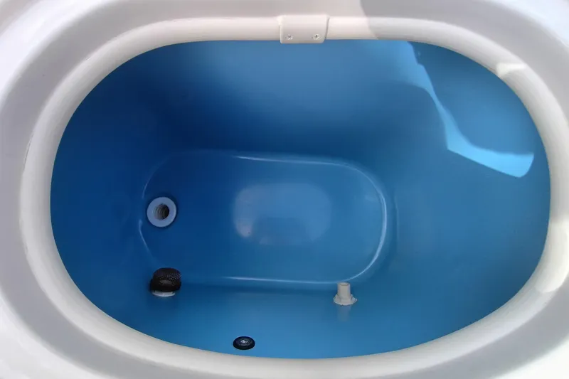 Slide: The Image of 2024 Sea Chaser 24 HFC boat livewell interior, blue and white design. - 32