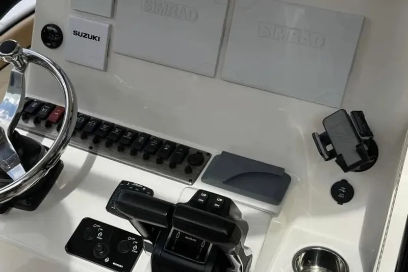 Slide: The Image of 2024 Sea Chaser 24 HFC boat with Suzuki outboard motor on trailer. - 4