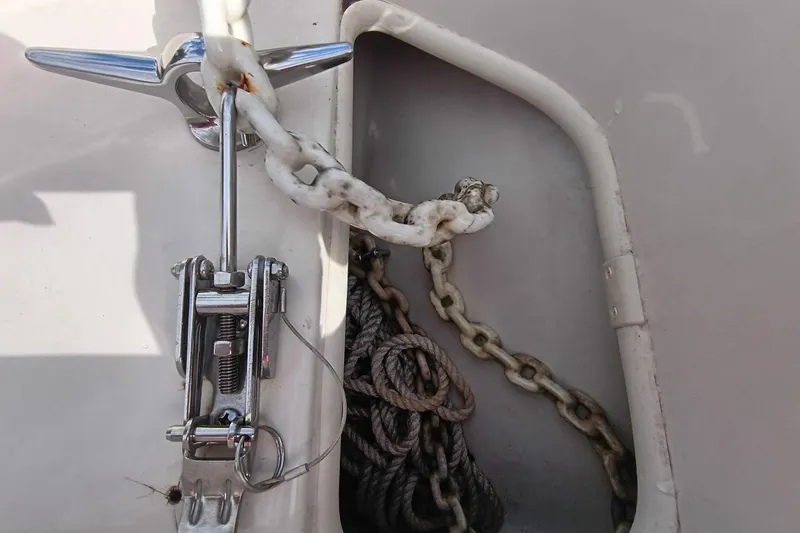 Slide: The Image of 2024 Sea Chaser 24 HFC boat anchor chain and cleat detail. - 48