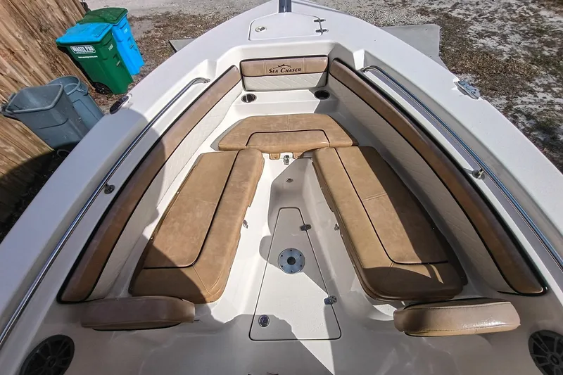 Slide: The Image of 2024 Sea Chaser 24 HFC boat interior with tan cushioned seating. - 55