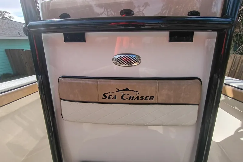 Slide: The Image of 2024 Sea Chaser 24 HFC boat interior with logo and padded panel. - 58