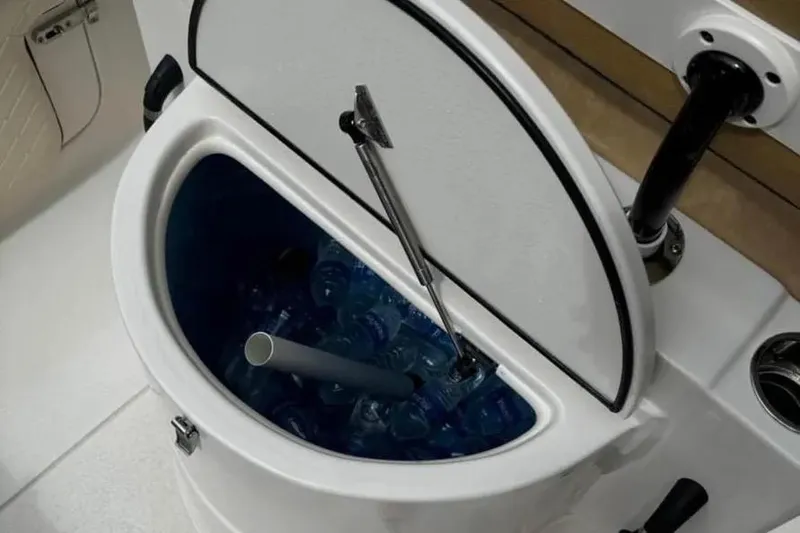 Slide: The Image of 2024 Sea Chaser 24 HFC boat with dual 140 horsepower engines, outdoor setting. - 9