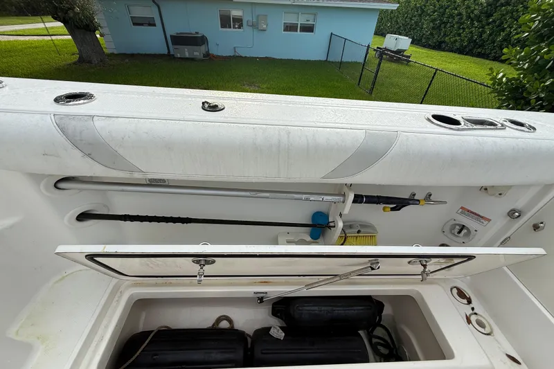 Slide: The Image of Engine compartment of 2011 Boston Whaler 285 Conquest with visible wiring and components. - 11