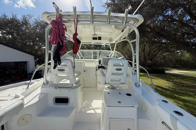 Slide: The Image of 2011 Boston Whaler 285 Conquest boat interior with seating and equipment. - 16