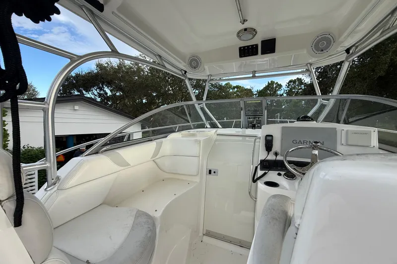 Slide: The Image of 2011 Boston Whaler 285 Conquest boat interior with seating and equipment. - 18