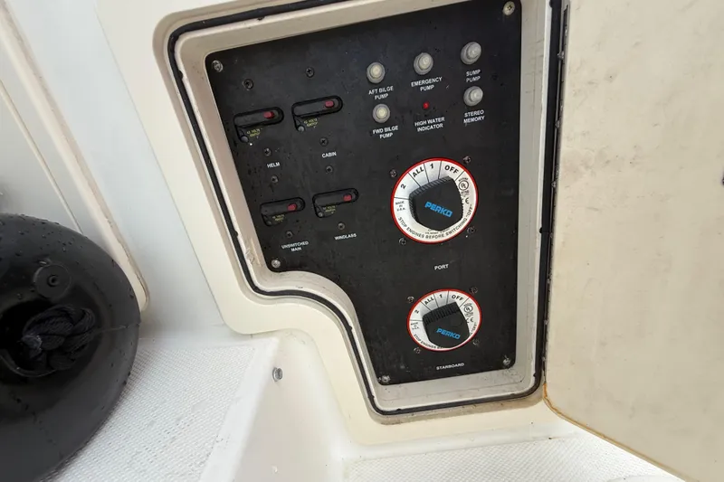 Slide: The Image of 2011 Boston Whaler 285 Conquest helm with Garmin navigation system and steering wheel. - 21