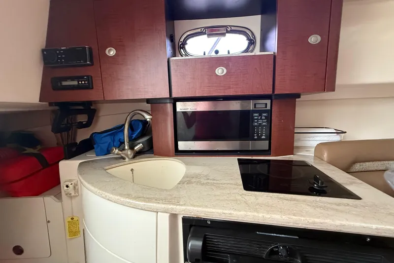 Slide: The Image of Fusion and Jensen audio systems on 2011 Boston Whaler 285 Conquest boat interior. - 35