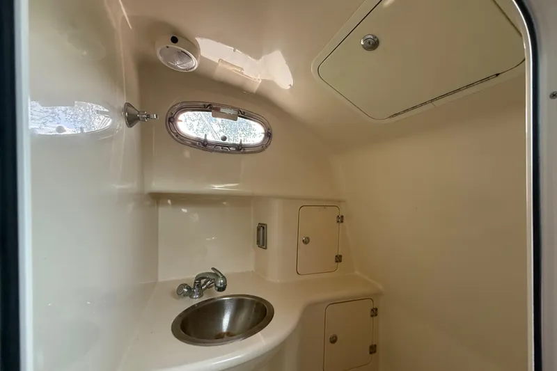 Slide: The Image of Electrical control panel on 2011 Boston Whaler 285 Conquest boat, featuring various switches and gauges. - 36