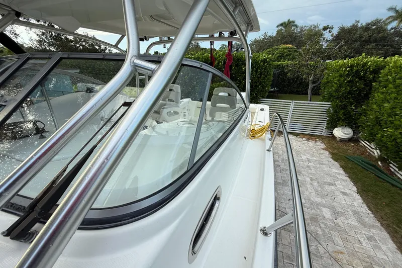 Slide: The Image of 2011 Boston Whaler 285 Conquest boat transom with trailer, showing underwater lights. - 44
