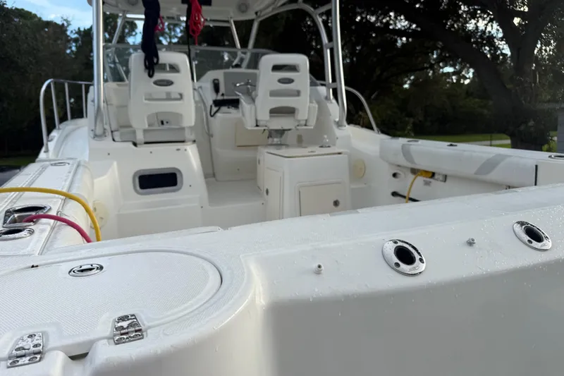 Slide: The Image of Control panel of a 2011 Boston Whaler 285 Conquest boat, featuring switches and dials. - 7