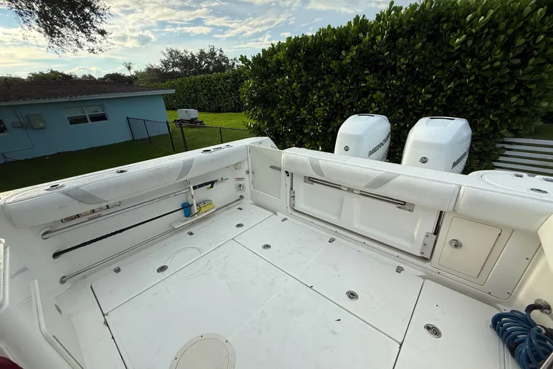 Slide: The Image of Engine compartment of a 2011 Boston Whaler 285 Conquest, showing various mechanical components. - 9