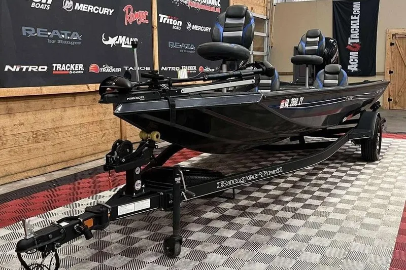 Slide: The Image of 2022 Ranger RT178 boat on trailer in showroom with branded backdrop. - 3