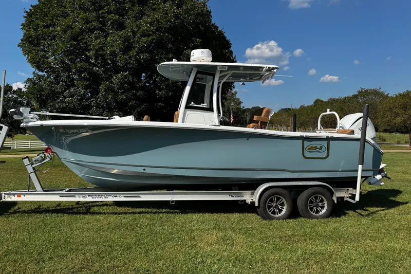 Slide: The Image of 2022 Sea Hunt Ultra 255 SE boat cruising on a scenic waterway. - 3