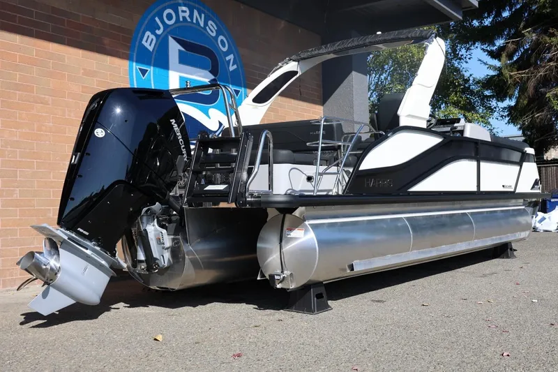 Slide: The Image of 2026 Harris Grand Mariner 250 interior with luxurious seating and storage compartments. - 15