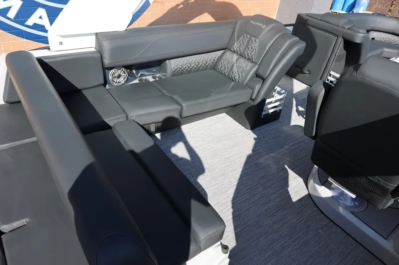 Slide: The Image of 2026 Harris Grand Mariner 250 helm with modern controls and dual screens. - 21