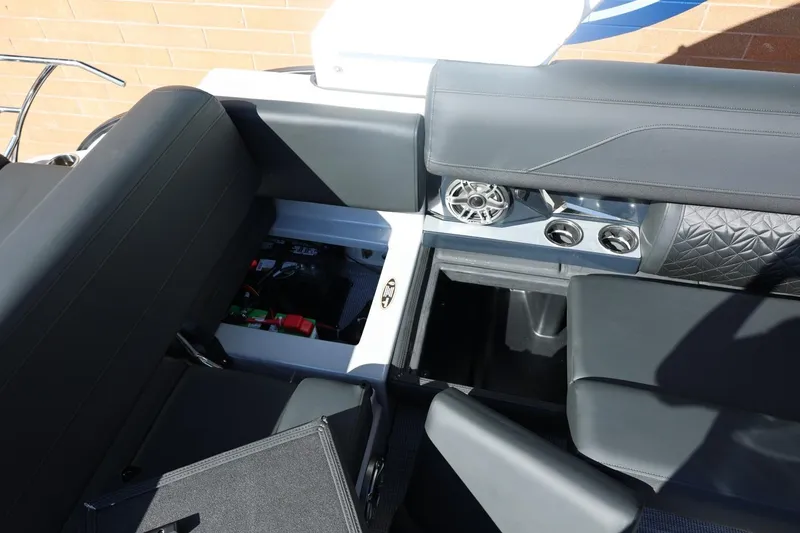 Slide: The Image of Throttle control of 2026 Harris Grand Mariner 250 boat, featuring safety warnings and cup holder. - 24