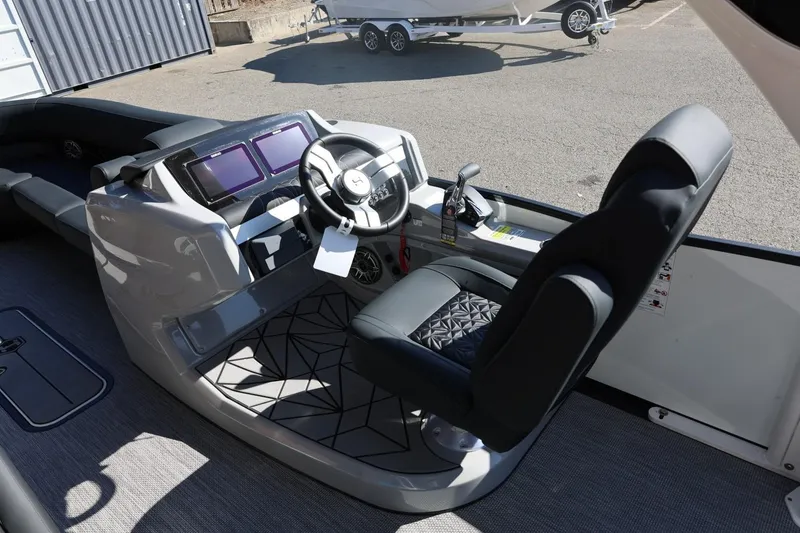 Slide: The Image of Simrad displays on 2026 Harris Grand Mariner 250 boat dashboard, showing navigation and engine data. - 27