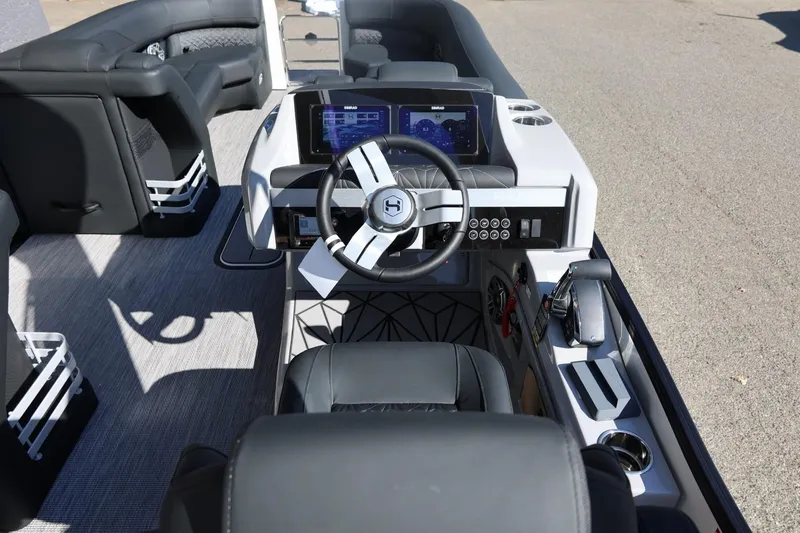 Slide: The Image of 2026 Harris Grand Mariner 250 boat interior with luxurious black seating and modern design. - 32