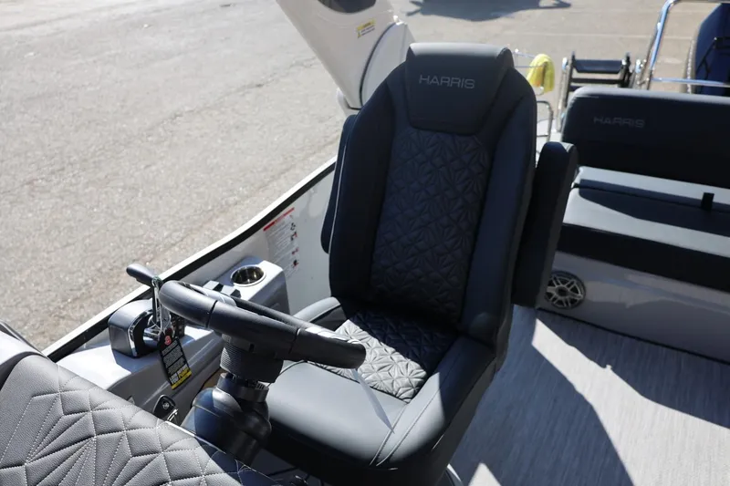 Slide: The Image of Interior detail of 2026 Harris Grand Mariner 250 boat, featuring sleek seating design. - 35