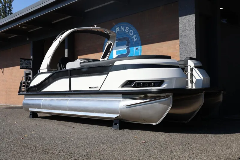 Slide: The Image of 2026 Harris Grand Mariner 250 pontoon boat displayed outdoors. - 4