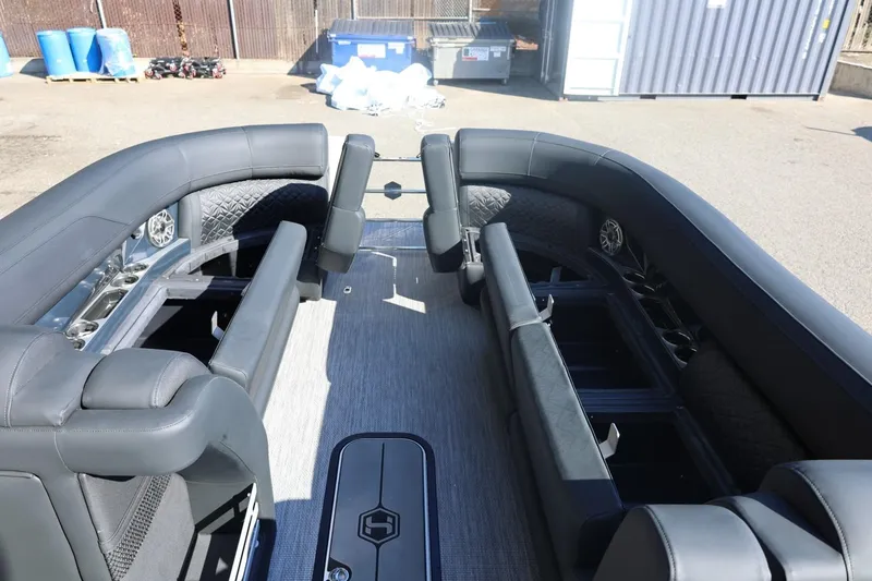 Slide: The Image of 2026 Harris Grand Mariner 250 boat interior with sleek seating and speaker detail. - 44