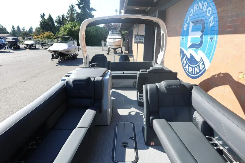 Slide: The Image of Steering wheel of 2026 Harris Grand Mariner 250 boat, featuring sleek design and controls. - 48