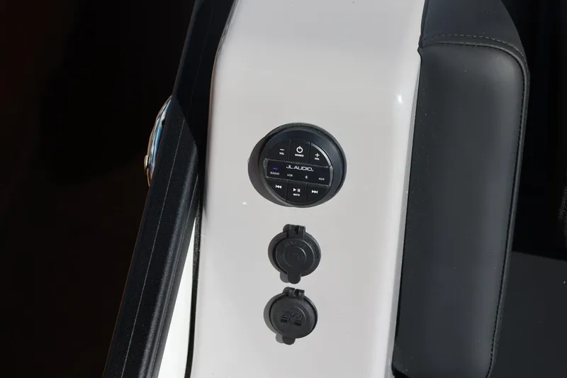 Slide: The Image of 2026 Harris Grand Mariner 250 pontoon boat on trailer at dealership. - 53